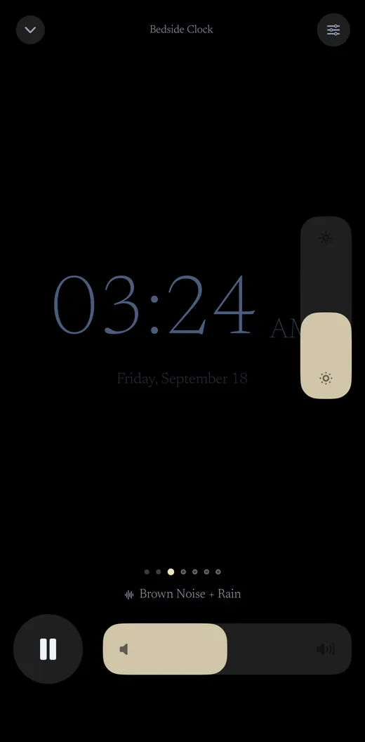 The bedside clock scene: a dim time and date on black.
